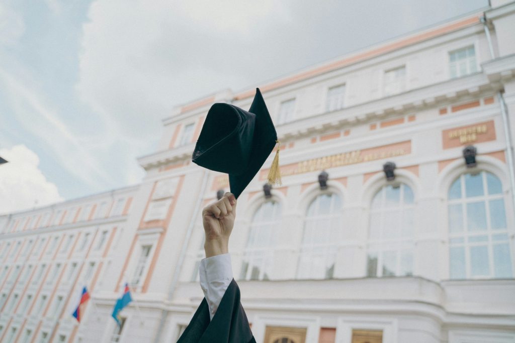 a person holding a black umbrella